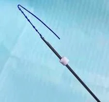 PDO thread with barbs inside a cannula used for PDO thread lift treatment